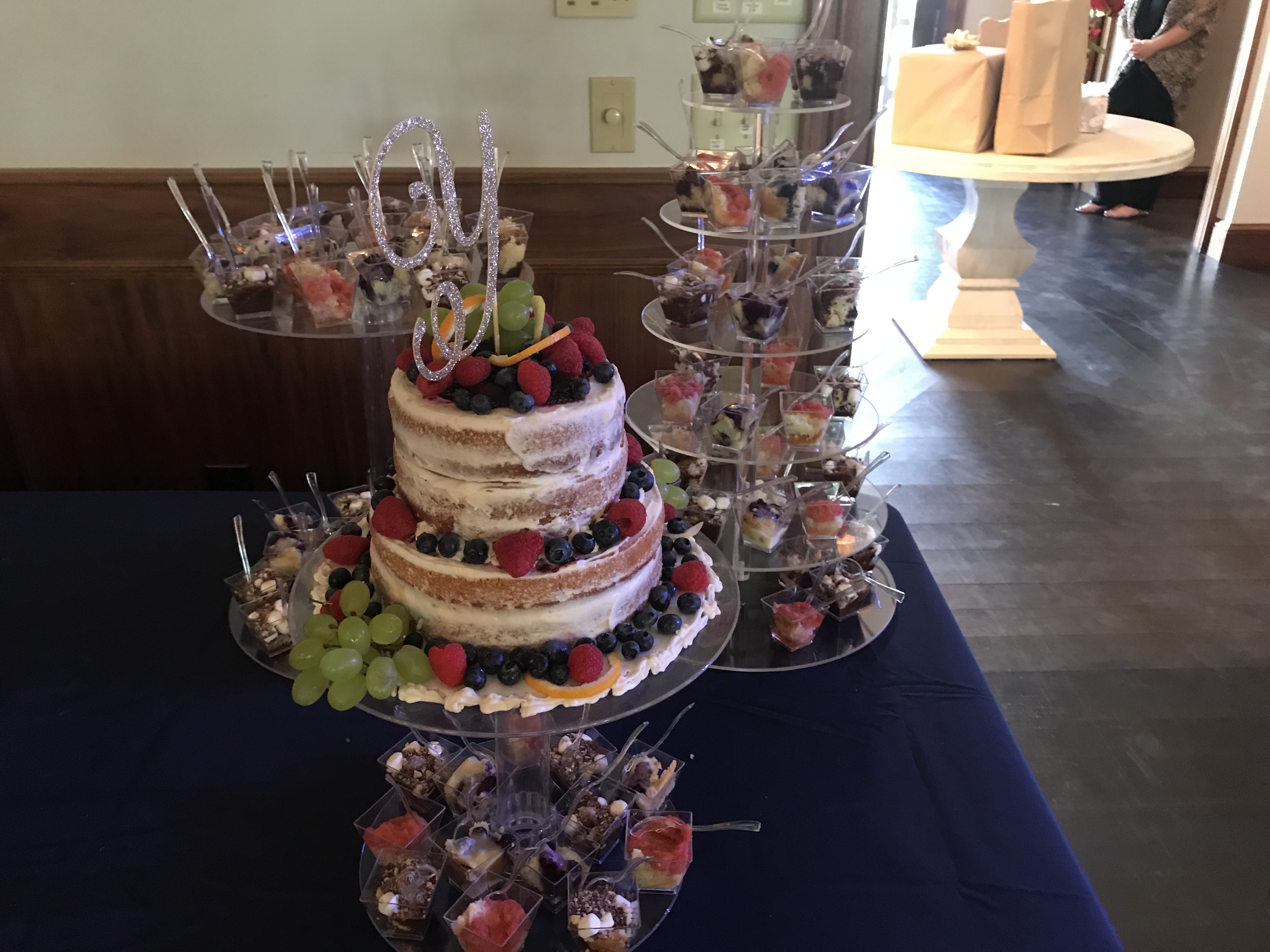 Semi-naked cake with fruit and dessert shots