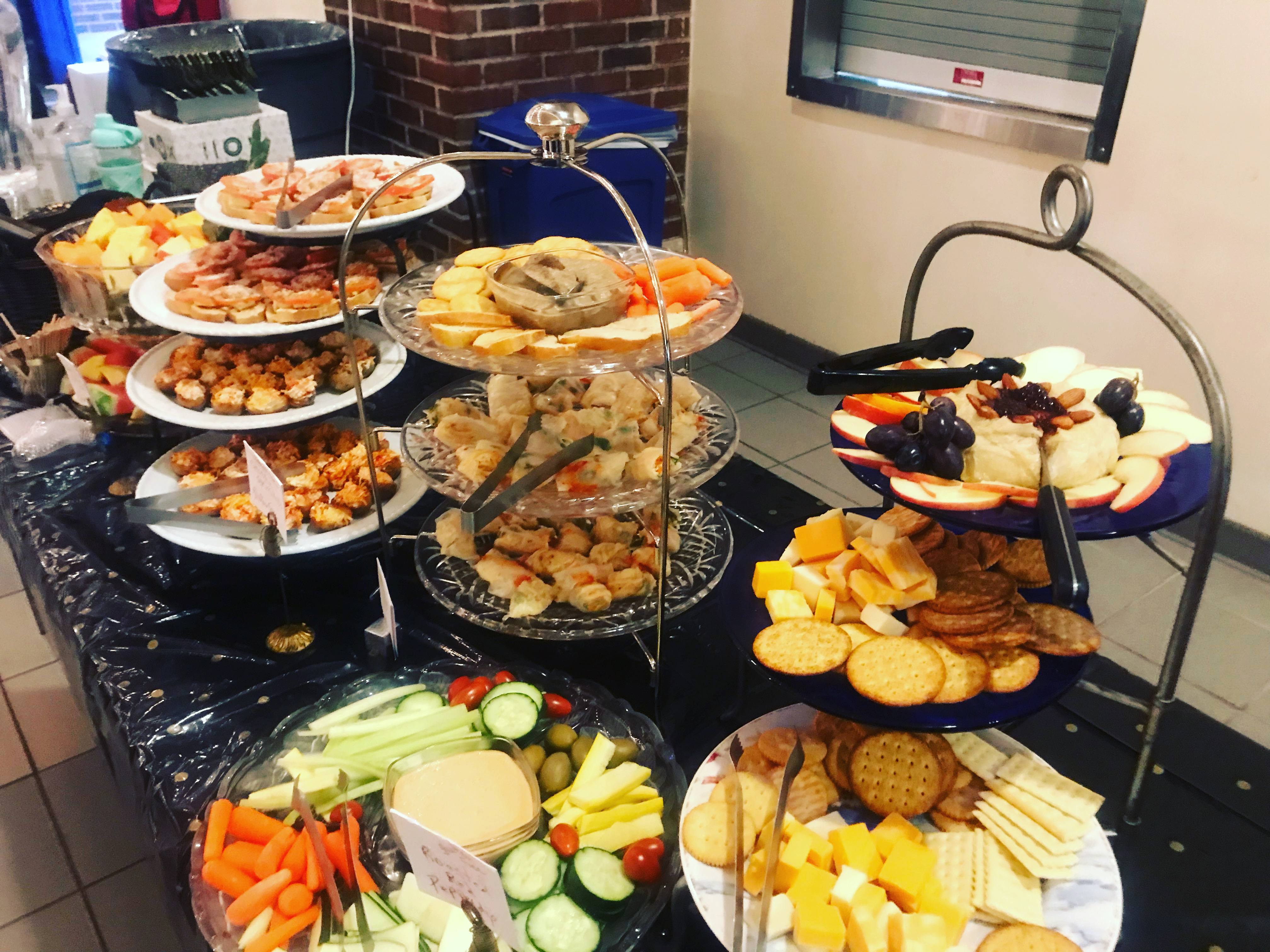 Heavy hors d'oeuvres buffet table with hot and cold stations