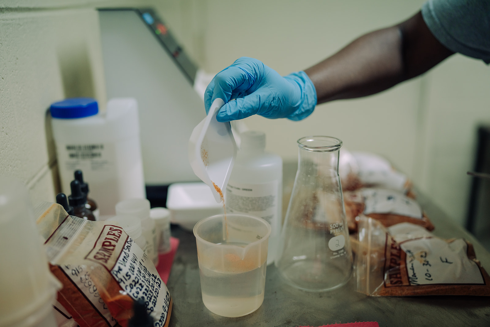 Prepared sample containers staged for quality-control testing at TEKPAK's Marion, AL facility