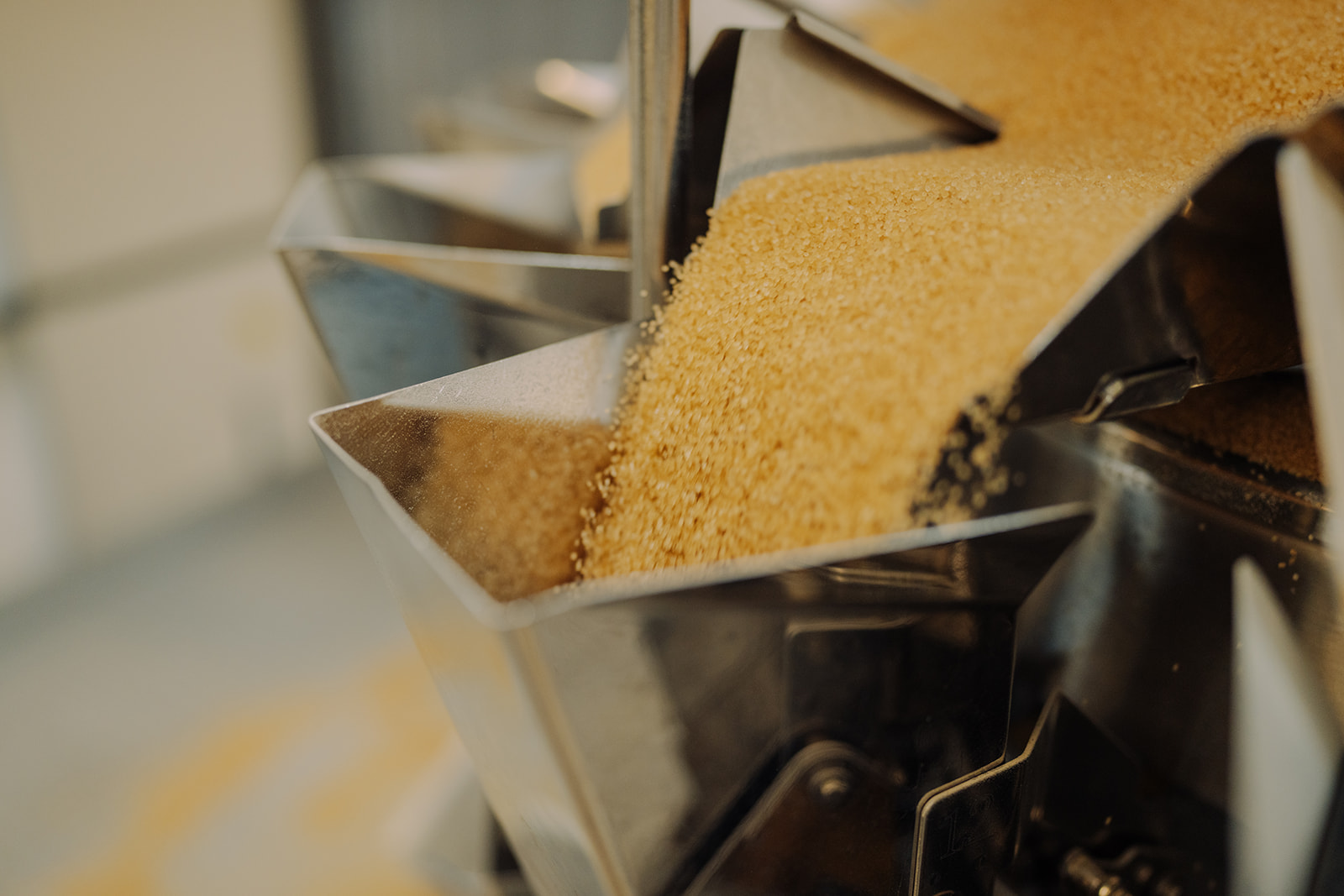 Granulated ingredient dispensing into filling equipment at TEKPAK's Marion, AL facility