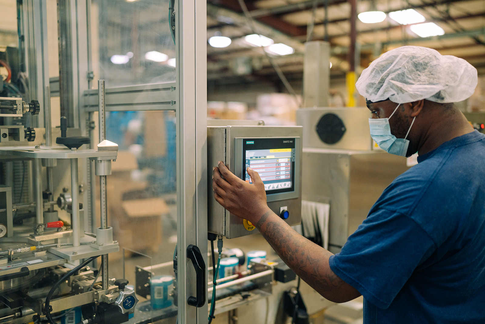 TEKPAK worker monitoring the production line at the Marion, AL facility