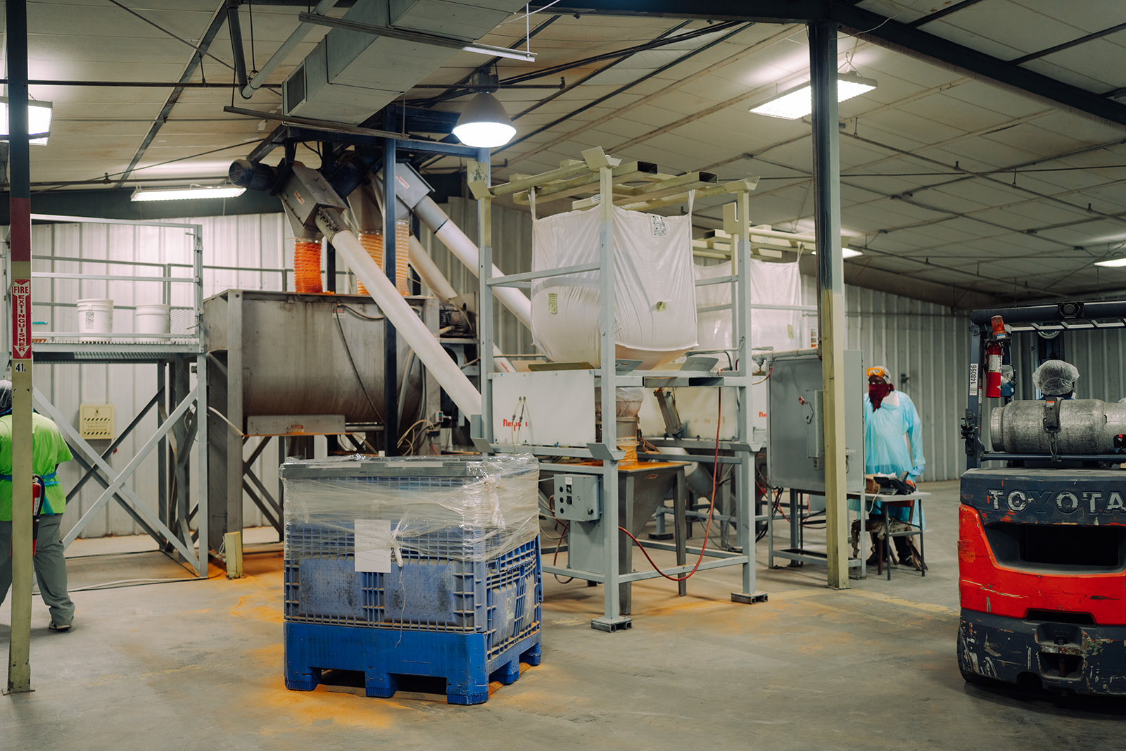 Forklift moving bulk totes in the blending area at TEKPAK's Marion, AL facility